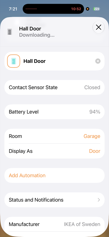 The Hall Door accessory settings in Apple Home, showing Contact Sensor State Closed, Battery Level 94 percent, Room Garage, and Display As Door.
